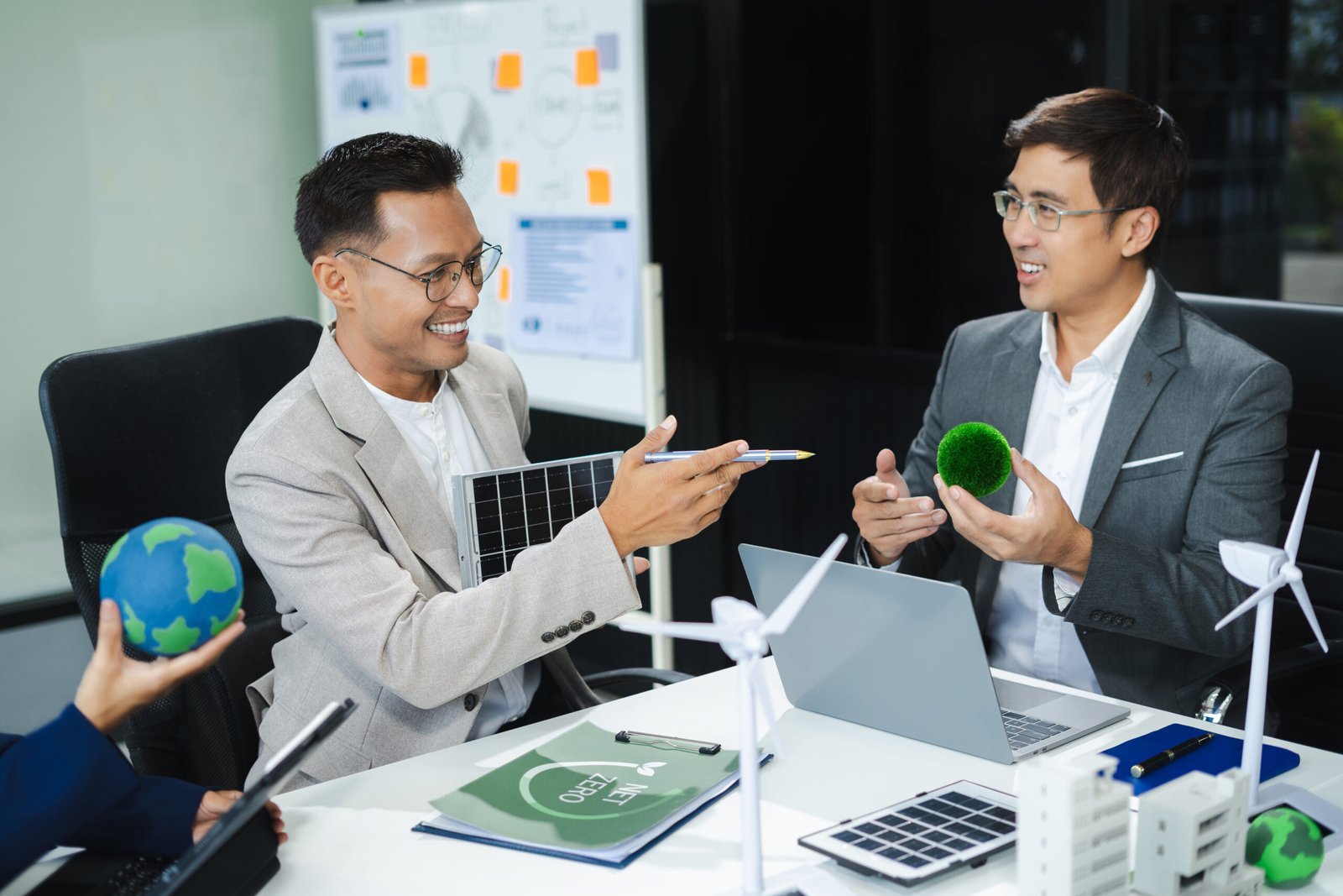 Engineer Teamwork Meeting, with partner on model building at company office working technology, Renewable energy-based green businesses and global warming.