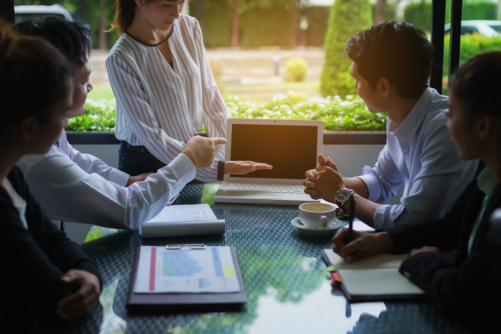 Businessmen negotiate terms and conditions before signing a business co-operation agreement.